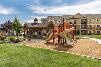 Orange and tan playground at Quail Springs Apartments in West Richland, WA